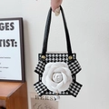 Detail of checkered case featuring white camellia flower and pearl charm handle - White / Samsung ZFlip3