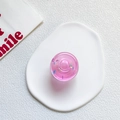 Supporto per telefono a ciambella rosa traslucido con glitter su sfondo bianco - Rosa Gelatina