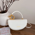 Minimalist white saddle shoulder bag with unique golden twisted metal handle and flap - White