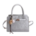 Silver metallic textured handbag with gold twist-lock and baseball charm detail - With Ornament / Silver
