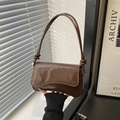 Chic coffee brown glossy patent leather underarm bag with elegant gold metal sphere accents - Brown