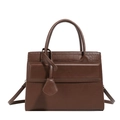 Brown faux leather handbag with crocodile texture and adjustable shoulder strap - Brown
