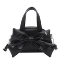 Black mini crossbody bag featuring a large bow and silver star rivets on a leather finish - Black