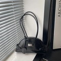 Minimalist black crescent shoulder bag with polished faux leather finish and metal plaque - Black