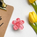 Close-up of pink cherry blossom phone grip with glitter resin and expanding stand - Rose Red