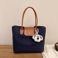 Große dunkelblaue Nylon-Einkaufstasche mit Ledergriffen und Plüschhund-Anhänger - Mit Anhänger / Marineblau