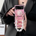 Detail of pink camellia floral phone case with pearl handle for Samsung Z Flip - Pink / Samsung Z Flip3