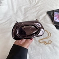 Metallic bronze hard-shell clutch bag with layered design and gold chain strap - Brown