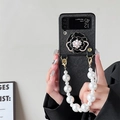 Detail of luxury camellia phone case with pearl strap and rhinestones for Z Flip series - Black / Samsung Z Flip3