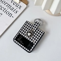 Detailed view of camellia and pearl ornament on houndstooth case for Samsung Z Flip - Black / Samsung ZFlip3
