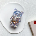 Supporto per telefono a forma di orso glitterato con fiore di perla su vassoio decorativo - Viola