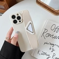 Creamy leather iPhone case with hand strap and metal triangle decor on art books - Apricot / iPhone 7/8/SE 2020