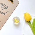 Detailed macro view of a clear resin phone socket featuring a vibrant yellow heart design - Yellow
