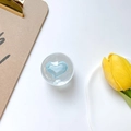 Close-up of a clear crystal ball phone socket with a light blue heart inside on white background - Light Blue
