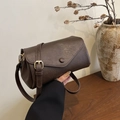 Minimalist dark brown cylinder shoulder bag with vintage pebble texture and gold buckle - Brown