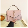 Minimalist light pink crossbody bag with pebbled leather texture and gold buckle - Pink