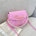 Pink pearl handle crossbody bag with mesh bow and polished faux leather finish - Pink
