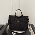 Sac fourre-tout noir en jacquard floral avec multiples poches et bandoulière réglable chic - Noir