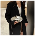 Close-up of irregular silver metallic fluid-shaped clutch bag with long chain strap - Silver