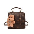 Vintage donkerbruine rugzak van kunstleer met cartoonprints en pluche honden hanger - Koffie Met Hanger