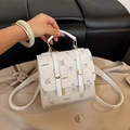 Chic beige mini backpack with cartoon prints and adjustable straps in textured faux leather - White