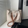 Chic beige tote bag with M-letter monogram print, metal logo, and brown leather straps - White