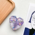 Detail of purple heart resin phone grip with glitter, sequins and a white pearl accent - Purple