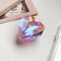 Macro shot of 3D heart-shaped phone grip with iridescent gradient and geometric cutting - Phantom Purple