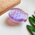 Macro view of 3D laser fish phone grip showing textured scales and purple gradient - Little Fish Stand-Magic Purple