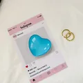 Blauer Herz-Kristall-Handyhalter mit verstellbaren Goldringen für das Smartphone - See Blau