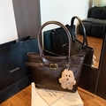 Dark brown matte leather tote bag with gold buckle detail and plush puppy charm - With Ornament / Coffee