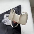 Minimalist white crescent shoulder bag with leather texture and elegant hobo silhouette - Off White