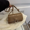 Brown leather crossbody bag with gold U-shaped buckle and knotted shoulder strap detail - Khaki