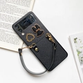 Close-up of black crossbody phone case for Galaxy Z Flip with heart and bear charms - Black / Samsung ZFlip3