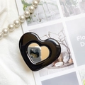 Detail shot of heart-shaped black phone grip with mirror on elegant fabric - Black
