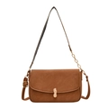Brown faux leather crossbody bag with distinctive gold peanut buckle and chain strap - Brown