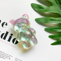 Detailed view of 3D iridescent bear phone grip with sparkling silver foil flakes - Turquoise Green