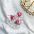 Detail shot of heart-shaped resin phone grip with miniature watermelon and ice cubes - Ice Fruit - Watermelon
