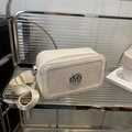 White leather shoulder bag with woven panel and silver M logo, chic crossbody style - White
