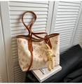 Minimalist beige tote bag with butterfly prints and rabbit plush charm on white books - With Pendant / Brown
