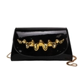Luxurious black patent leather crossbody bag with iconic gold wave metal hardware and chain - Black