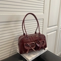 Deep red patent leather shoulder bag with double pockets and decorative bows - Red