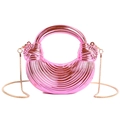 Metallic pink acrylic half-moon evening clutch with striped texture and gold chain - Pink