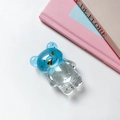 Detail of a bear-shaped phone grip with gold foil inside a blue resin bear-shaped socket - Gold Foil Bear Stand - Spliced - Transparent Blue White