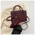 Close-up of wine red quilted handbag with matching coin purse and gold hardware - Burgundy