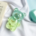Macro view of a bear-shaped resin phone socket with gold foil and green gradient effect - Gold Foil Bear-Stitched-Double Green