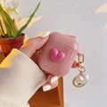 Pink heart silicone case for AirPods with pearl keychain held by a manicured hand - Pink Heart & Coin Pendant / AirPods 1/2 Gen