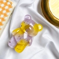 Detail of purple and yellow resin bear phone grip with sparkling gold leaf flakes - Gold Foil Bear-Contrasting-Purple Yellow