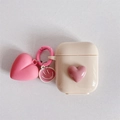 Cream silicone AirPods case featuring a 3D pink heart charm and round smiling pendant - Apricot With Pink Heart Charm / AirPods 1/2 Gen