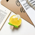Detail of yellow peach popsicle phone grip featuring a glossy resin finish and wood stick - Transparent Stand - Fruit Popsicle - Yellow Peach